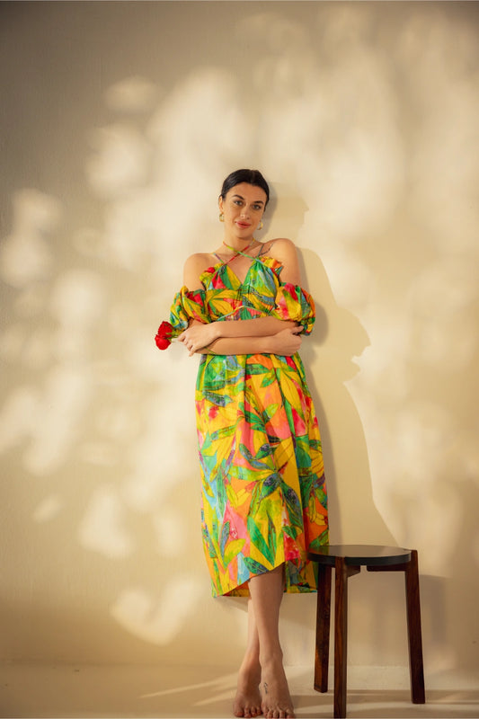 Front view of long tropical print dress with vibrant colors