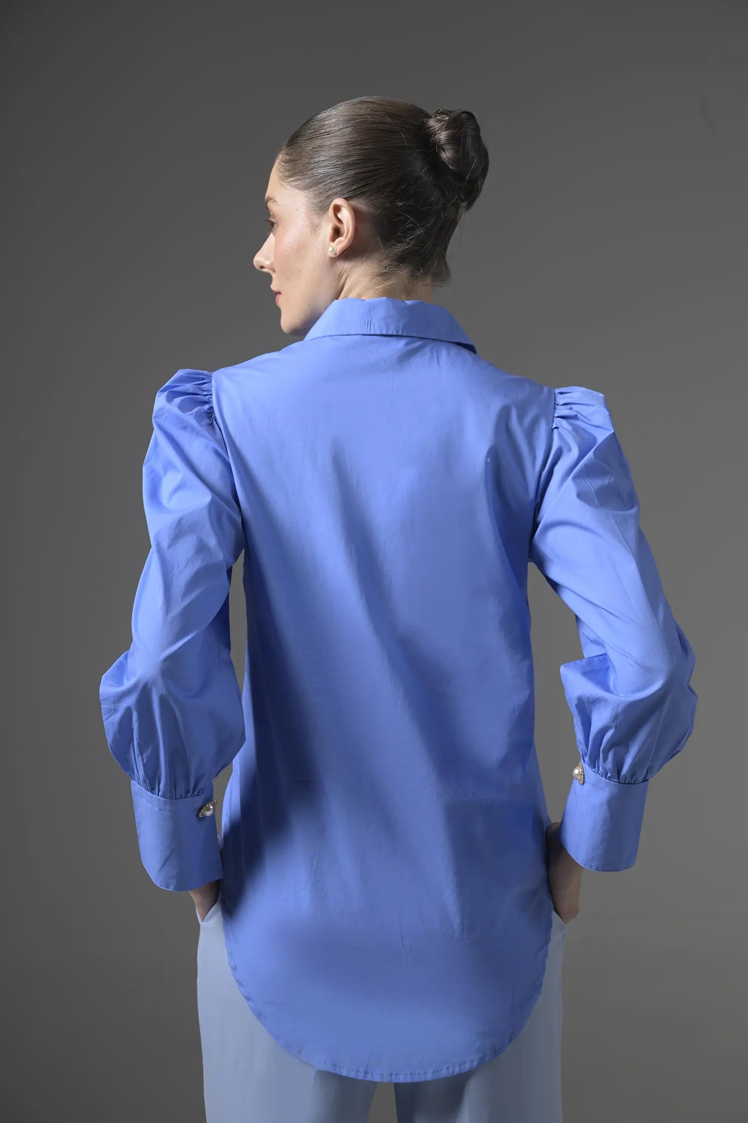 Front view of Muggnos blouse with elegant pattern